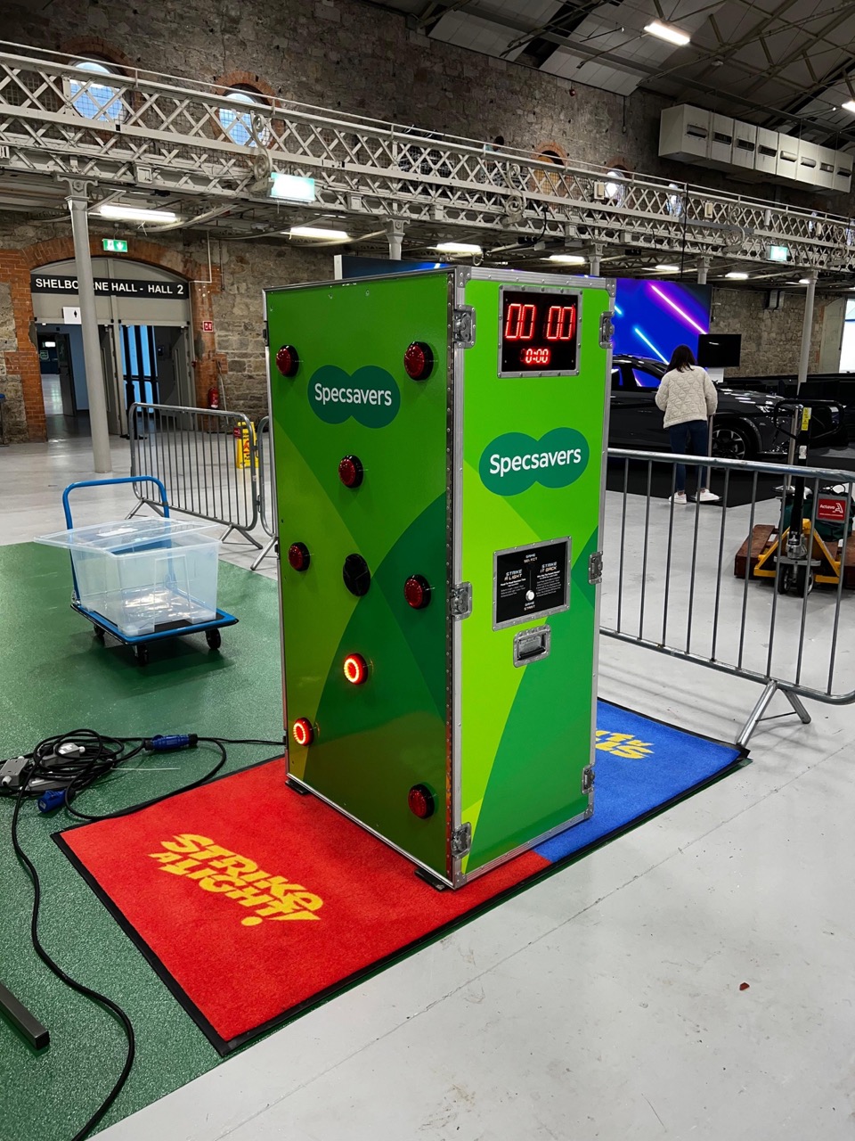 Specsavers Strike A Light Upright at Shelbourne Hall | Entertainment Solutions Specsavers Strike A Light Upright hire at Shelbourne Hall exhibition stand