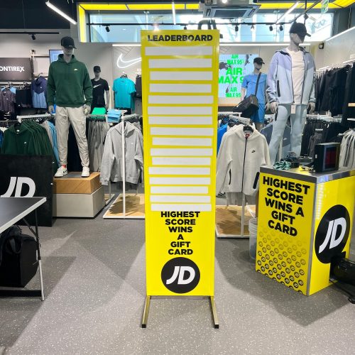 Custom branded magnetic leaderboard in JD Sports livery at a retail activation