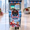 North Pole Nitro Christmas-dressed Sega Rally driving simulator with festive Alpine artwork, set up in an office for a corporate Christmas party (concept artwork)